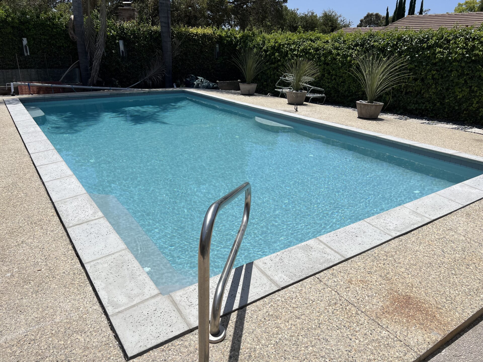 CUSTOM TILE AND COPING OPTIONS FOR A UNIQUE POOL DESIGN